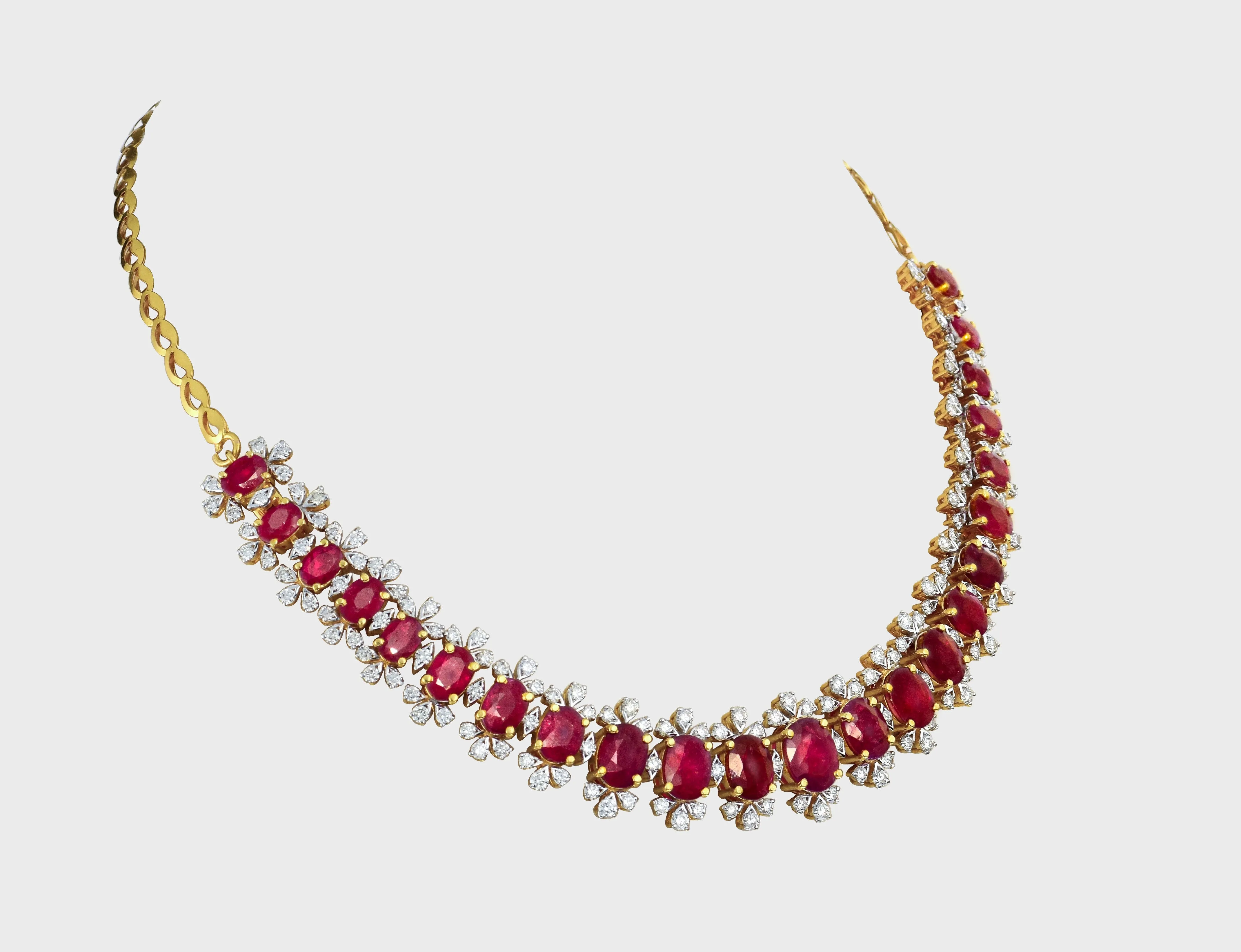 Embrace luxury and allure with our Ruby oval and diamond Necklace cum Bracelet set. Radiating elegance and sophistication, this exquisite ensemble effortlessly blends classic charm with modern glamour.(PGDNE0126)