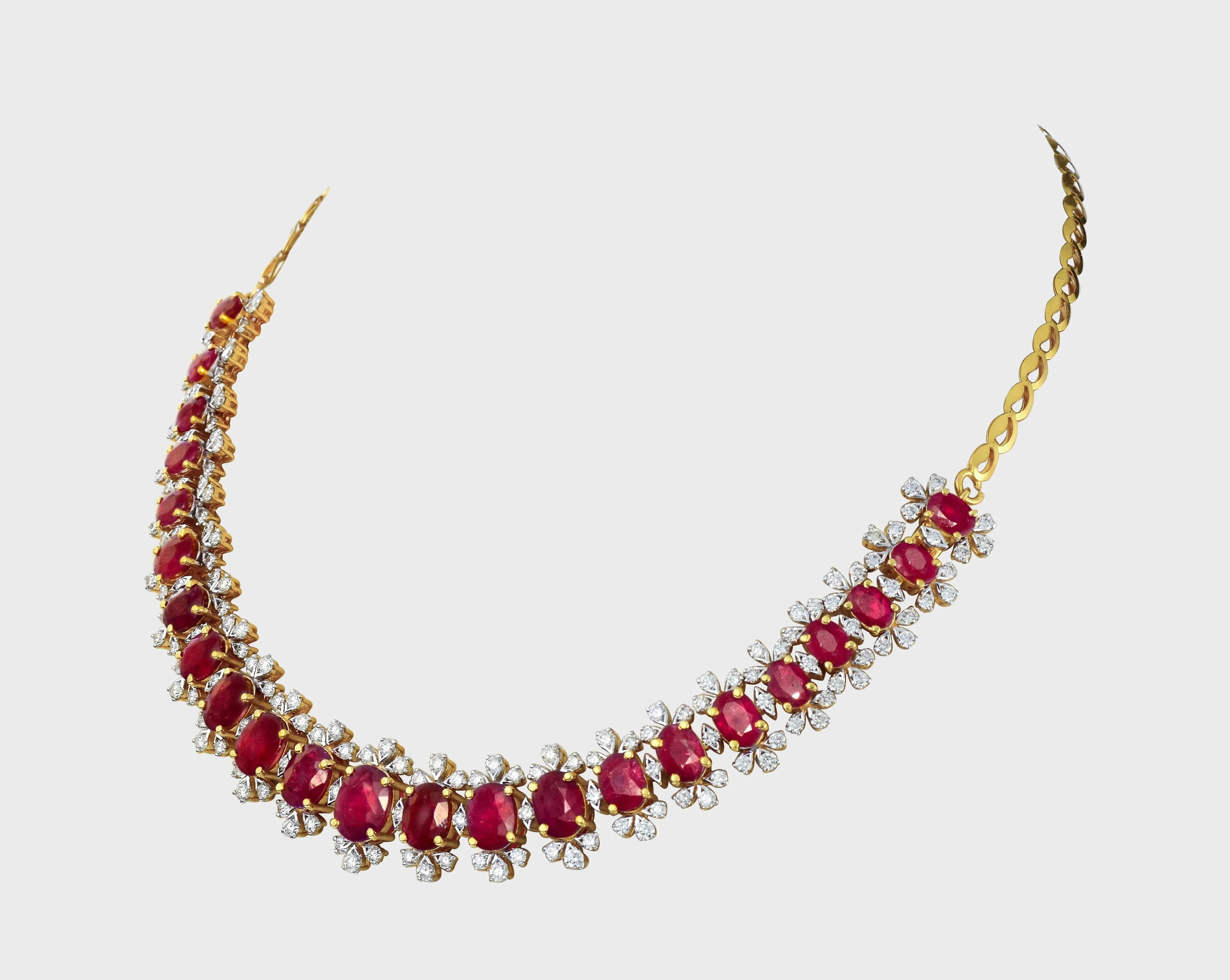 Embrace luxury and allure with our Ruby oval and diamond Necklace cum Bracelet set. Radiating elegance and sophistication, this exquisite ensemble effortlessly blends classic charm with modern glamour.(PGDNE0126)