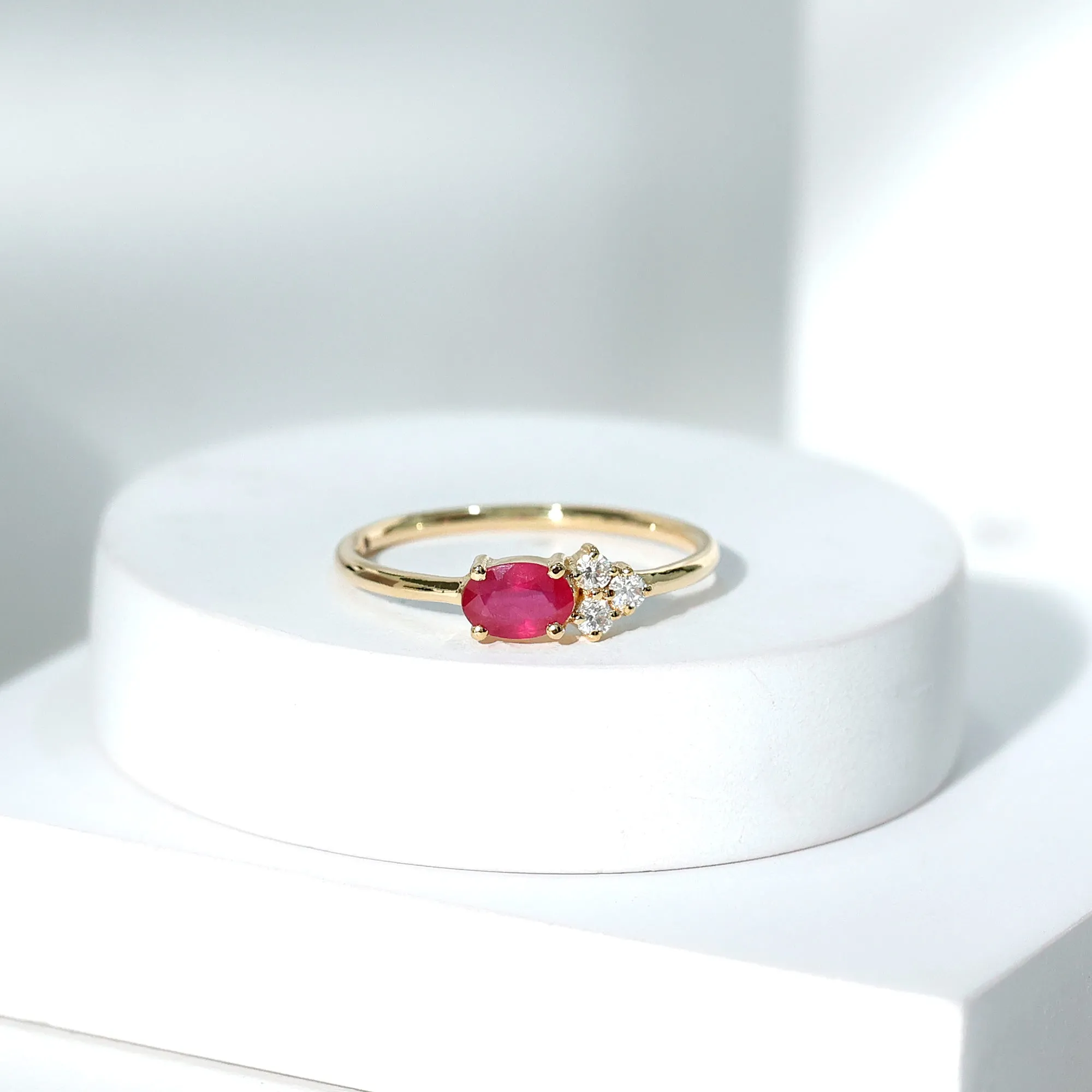 Oval Cut Ruby Promise Ring with Diamond Trio