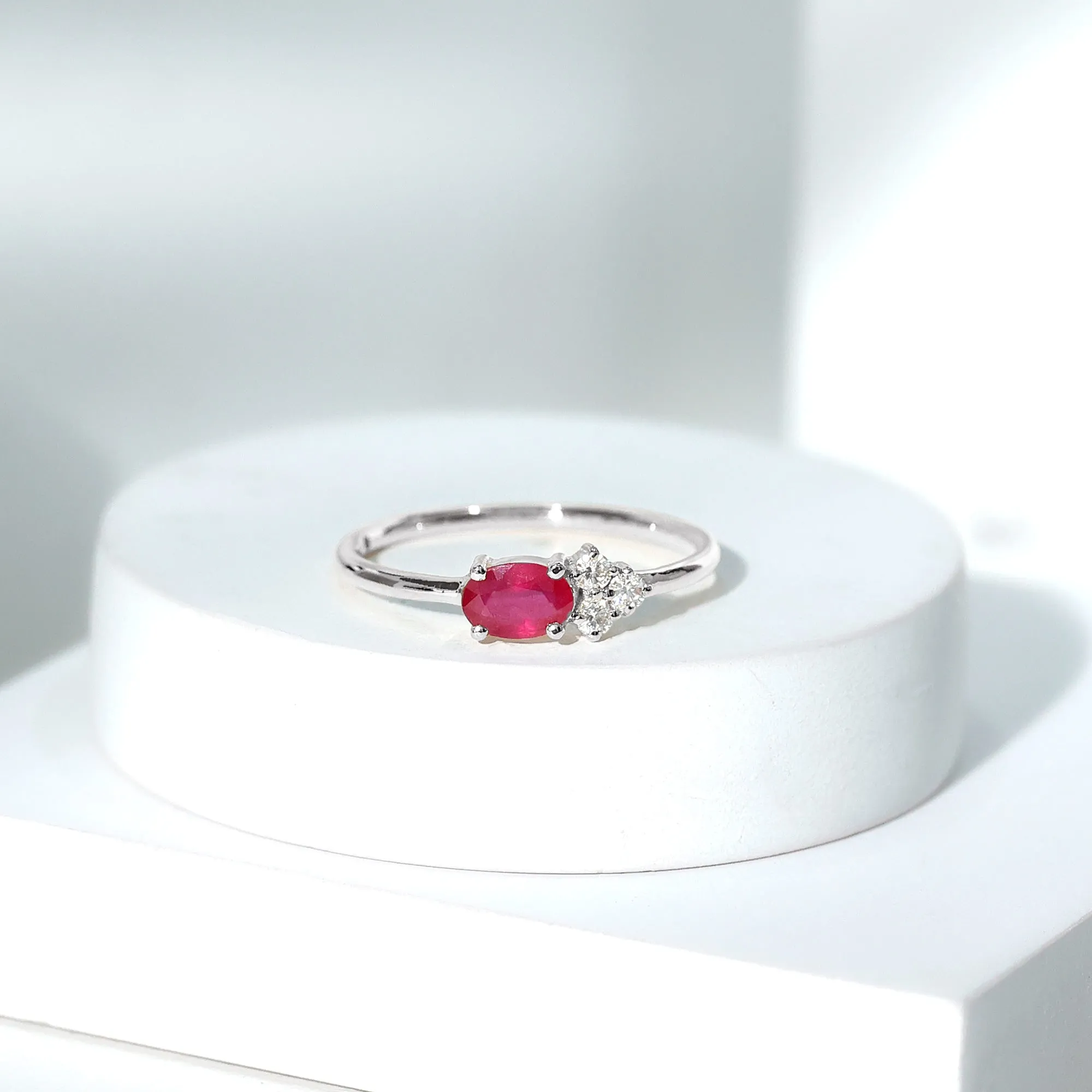 Oval Cut Ruby Promise Ring with Diamond Trio