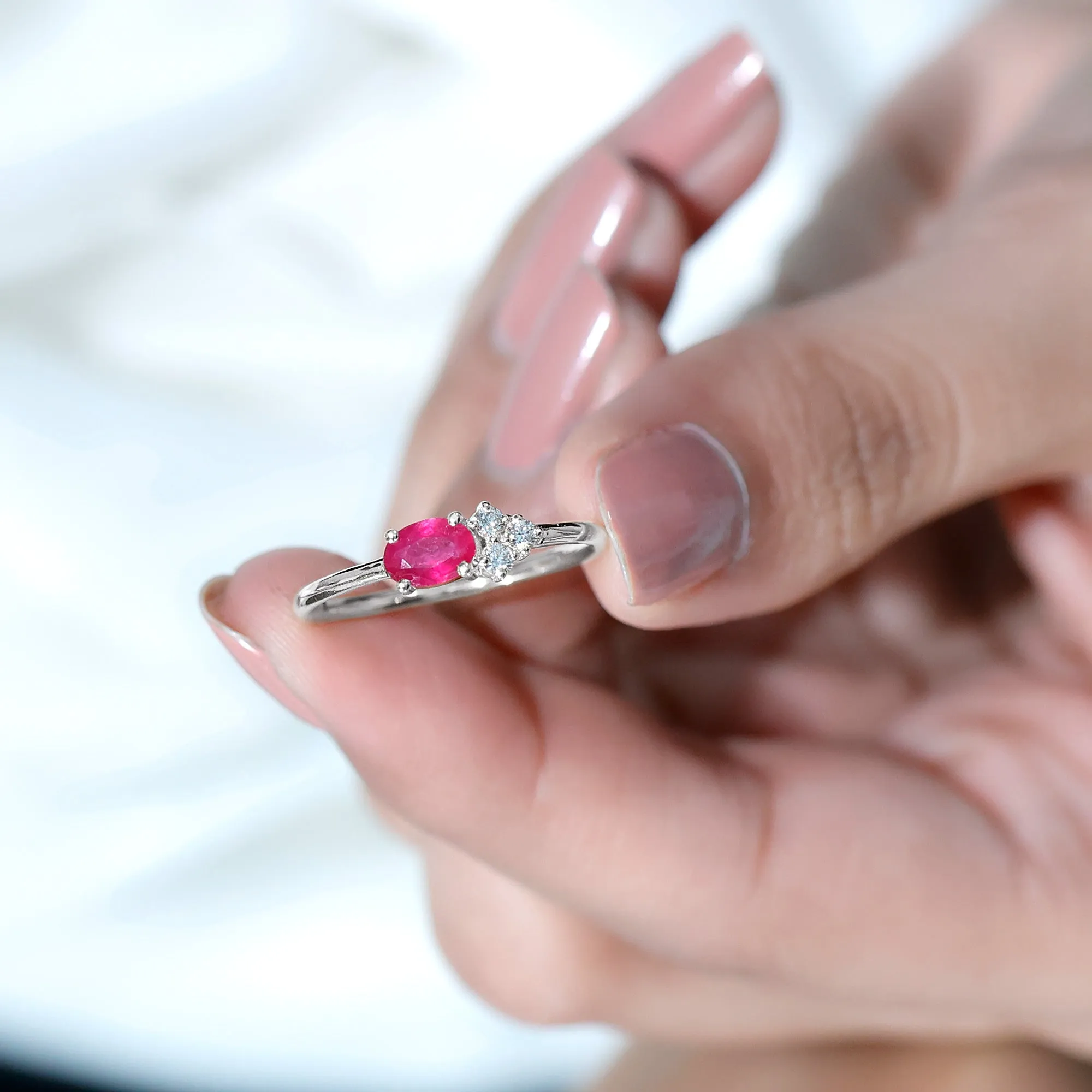 Oval Cut Ruby Promise Ring with Diamond Trio
